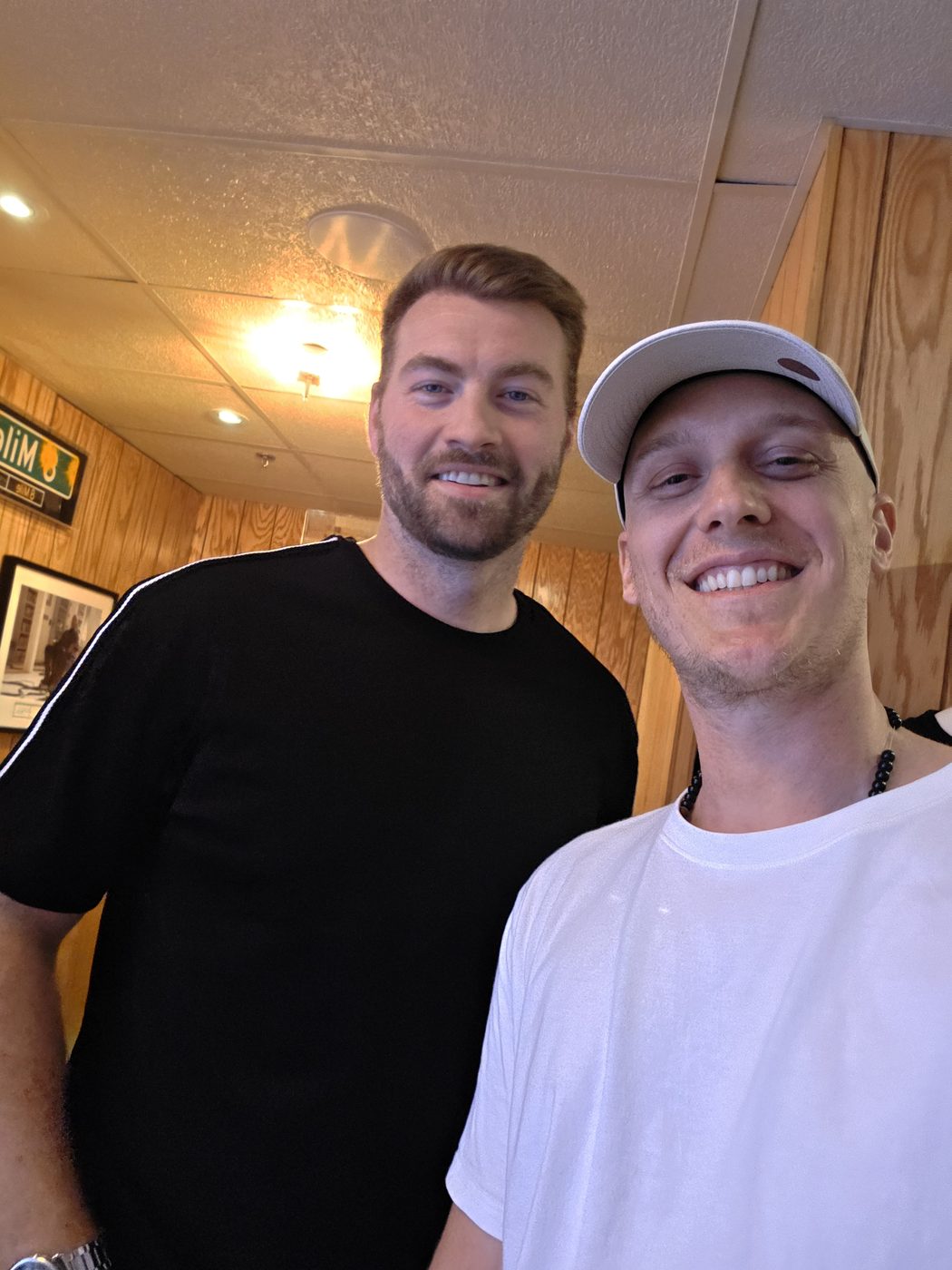 Selfie of the author with Evan McClintock, Hailie Jade's husband, inside the wood-panelled Trailer shop above Mom's Spaghetti in Detroit